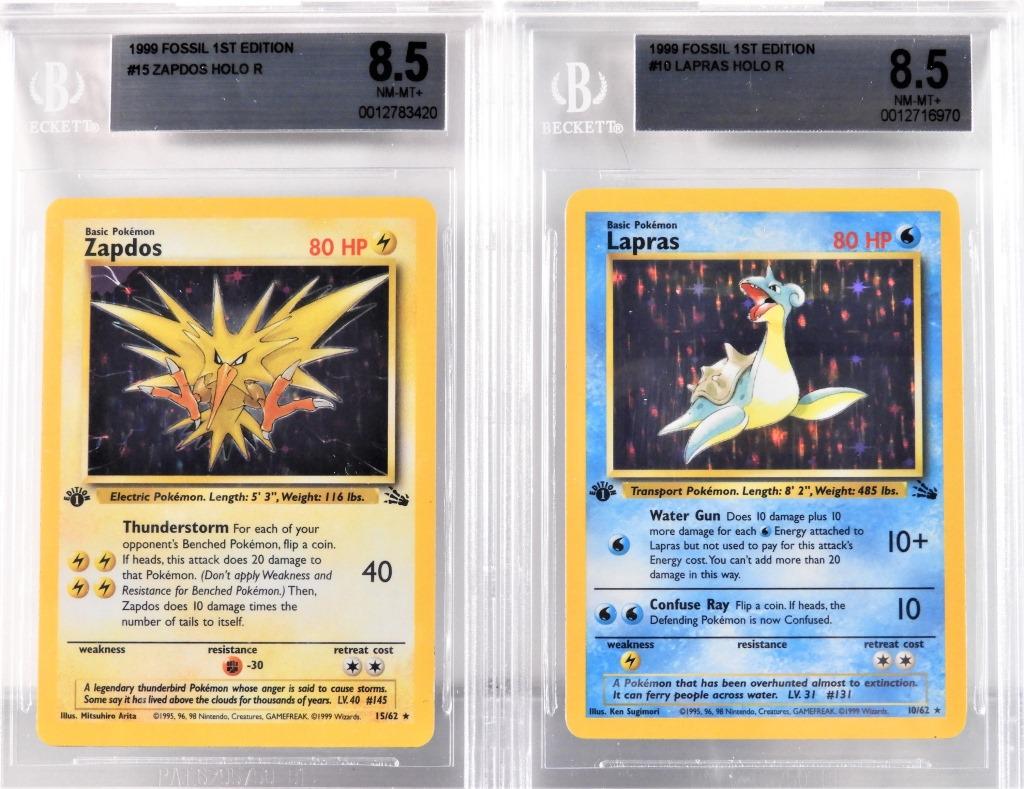 2 1999 Pokemon Fossil 1st Ed Lapras Zapdos BGS 8.5: United States,1999 Group includes 1999 Pokemon Fossil 1st Edition Lapras and Zapdos holographic trading cards, both BGS 8.5 NM-MT+ BGS case 5 1/8" x 3 1/4"