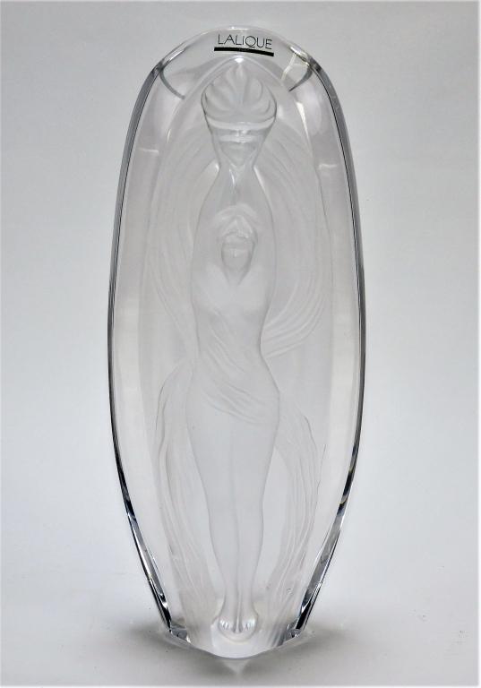 Marie Claude Lalique Eroica Vase: France,20th Century Shapely polished colorless glass vase decorated with a nude frosted glass woman holding a torch. Glass,Approx. 13 1/4" t x 5 3/4" w x 3 1/2" d. Signed and dated "M. Lalique 1989" o