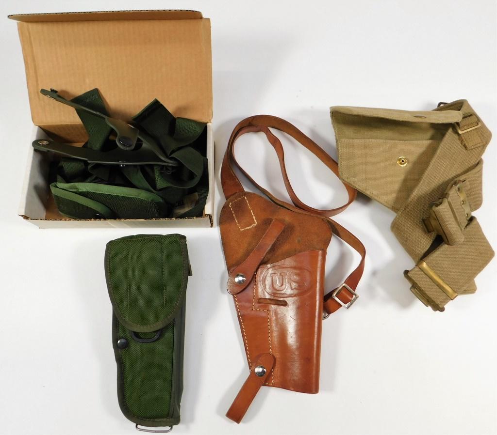 Group of Pistol Holsters: United States, England,C. 1940s-90s A U.S. M-12 holster with shoulder holster attachment, a shoulder holster for a 1911, and a British canvas holster dated 1943 and belt for a Webley revolver. ,. From