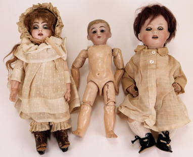 3PC Hermann Steiner & Other German Bisque Dolls: Germany,Early 20th Century Includes a Hermann Steiner brunette doll with blue glass eyes in a white dress, socks, and black shoes, a blonde doll with blue eyes in a white dress, lace bonnet, and brown