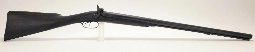 Double Barrel Shotgun: United States,Early 20th Century Hammer gun with German silver wrist plate and steel fittings. Overall approx. 42 1/2".Barrel 26 1/2".Wood, metal From the collection of an East Greenwich, Rhode Island