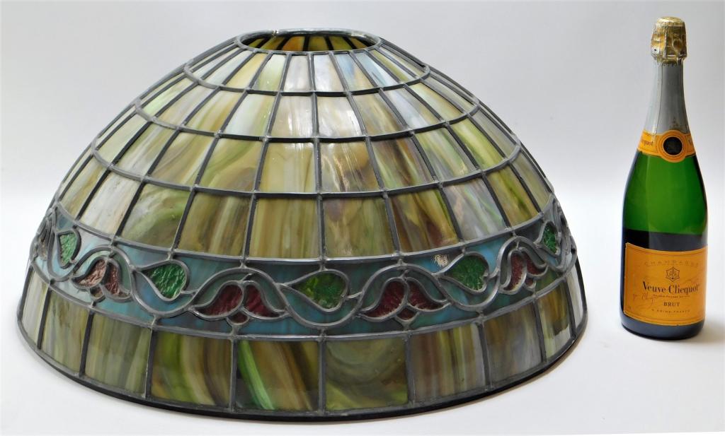 Antique Leaded Hanging Slag Glass Chandelier Shade: United States,Early 20th Century Paneled green, white, and brown slag glass with belt of blue slag glass decorated with red and green floral design.,Overall approx 11" x 24" dia..Top of shade opening 