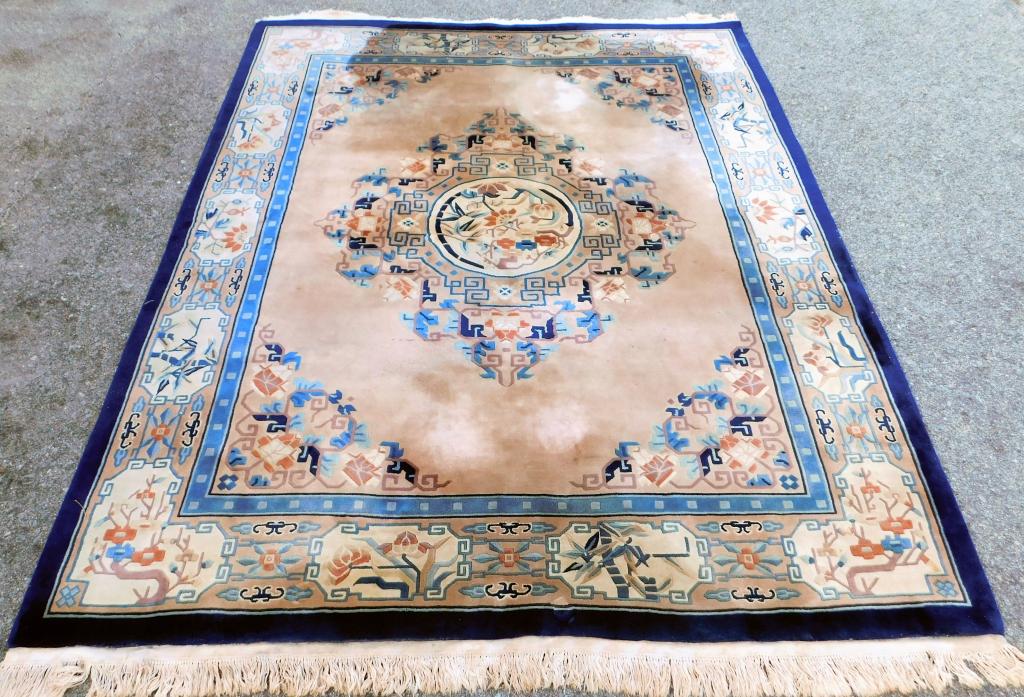 Chinese Art Deco Floral Rug: China,20th Century Rust, mauve, navy blue, blue, and tan central floral medallion over tan field surrounded by botanical boarders.,Approx. 10' 1" x 8' 1". From the collection of a Warwick, Rhode Islan