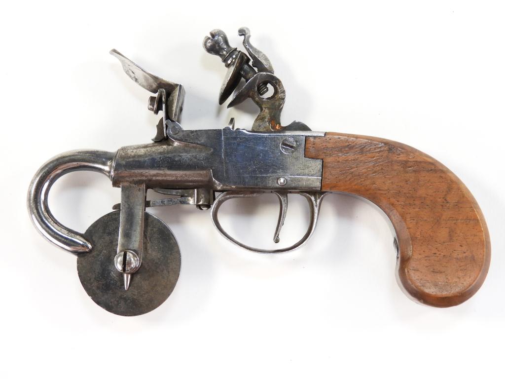 Flintlock Powder Tester with a Steel Frame: England C. late 18th/early 19th century Walnut grip, unmarked steel frame, reinforced cock, and a measuring wheel. Overall lg. 5 7/8".