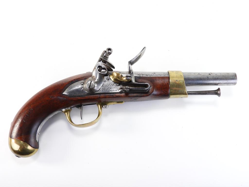 French Model 1813 Flintlock Pistol: France C. 1813 .69 bore, walnut stock stamped on the right side of the handle "PC 1813," with numbers on the left side behind the side plate, brass butt cap with a steel back strap, brass trigger guar