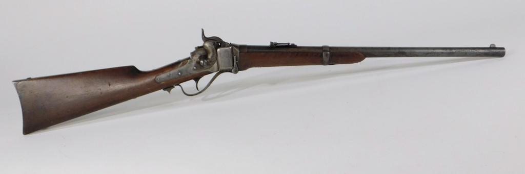 Sharps New Model 1863 Conversion Carbine: United States C. 1863-64 .52 caliber, serial number C5594, walnut stock with a cartouche on the left side of the butt, steel fittings, lock marked on both sides with patent dates. Barrel lg. 22".Overa