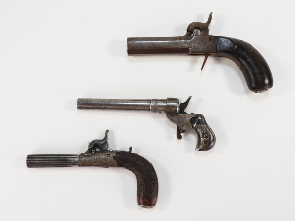 Three Single Shot Pistols: European/English Mid to late-19th century A Belgian single shot pistol with an octagonal barrel and .69 caliber bore, an English boxlock percussion pistol with checkered walnut grips, marked "Smith" o