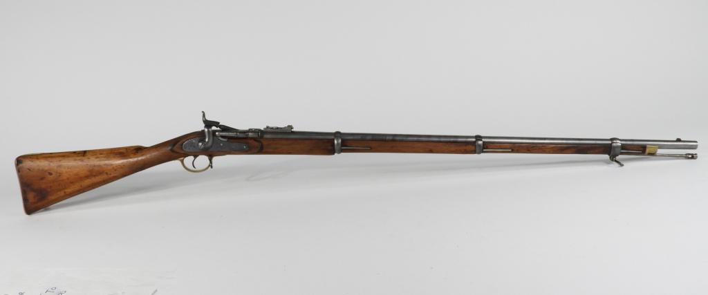 British Pattern 1853 Enfield Snider Conversion: England C. 1852 .577 caliber, walnut stock, has Middle Eastern markings on the butt plate tang, barrel tang, and rear sight, marked on the tail of the lock with a crown over "VR" and 1852/TOWER" in fr