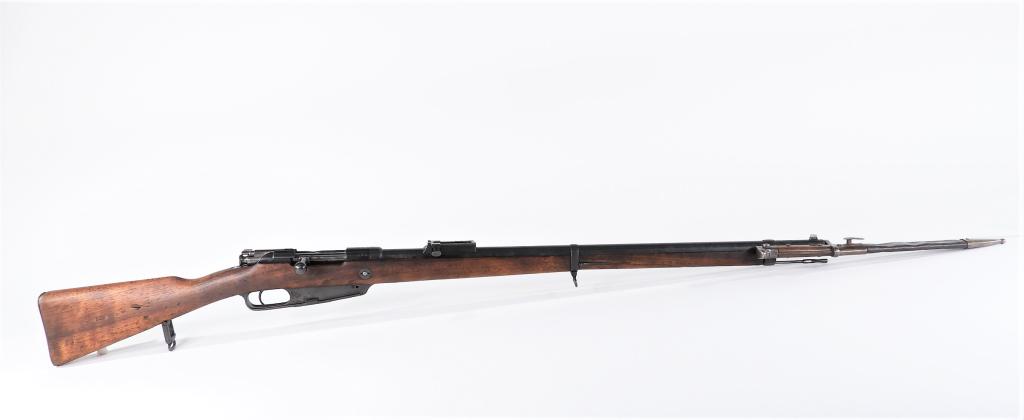 German Model 1888 Commission Rifle and Bayonet: Germany C. 1892 7.92Ã—57mm Mauser, serial number 9298, walnut stock, steel fittings, marked on the receiver ring "AMBERG/1892," and on the left side of the receiver "Gew. 88.," with a bayonet and s