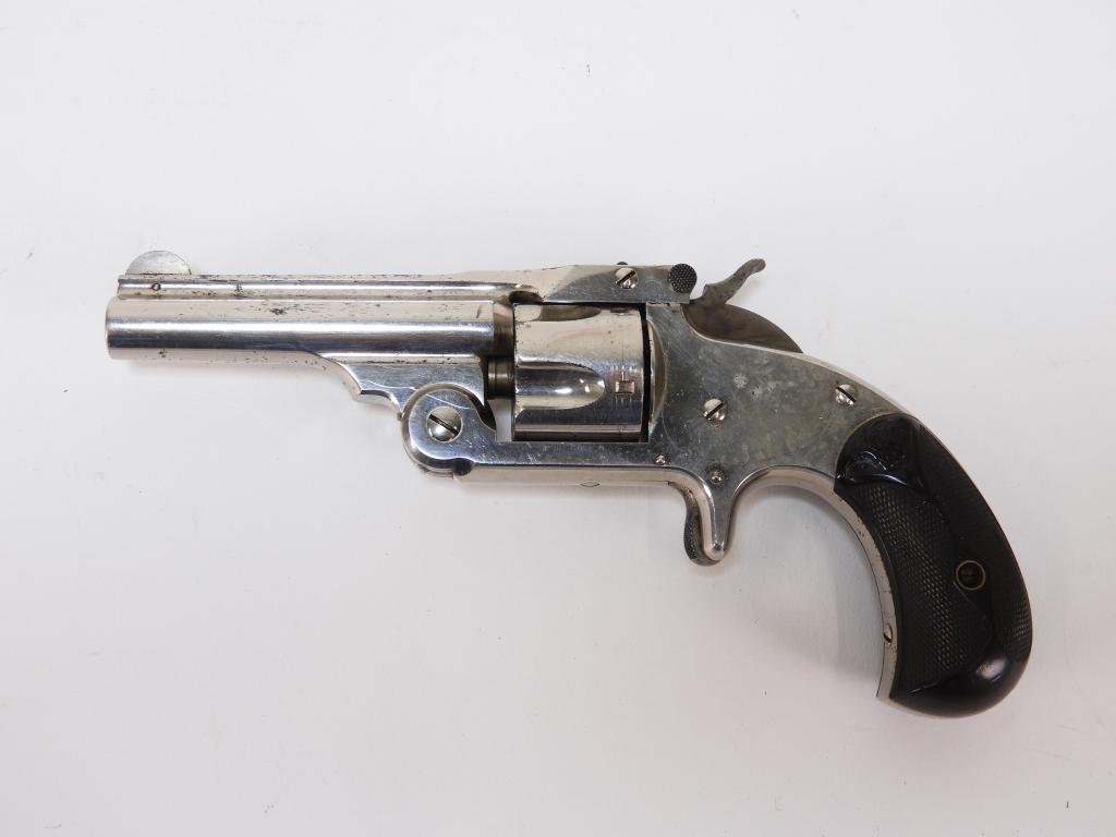 Smith & Wesson Model 1 1/2 Revolver: United States C. 1878-92 .32 caliber, serial number 44087, checkered hard plastic grips with "S&W," nickel finish, marked on the top of the barrel with patent dates. Barrel lg. 3".Overall lg. 6 3/4"