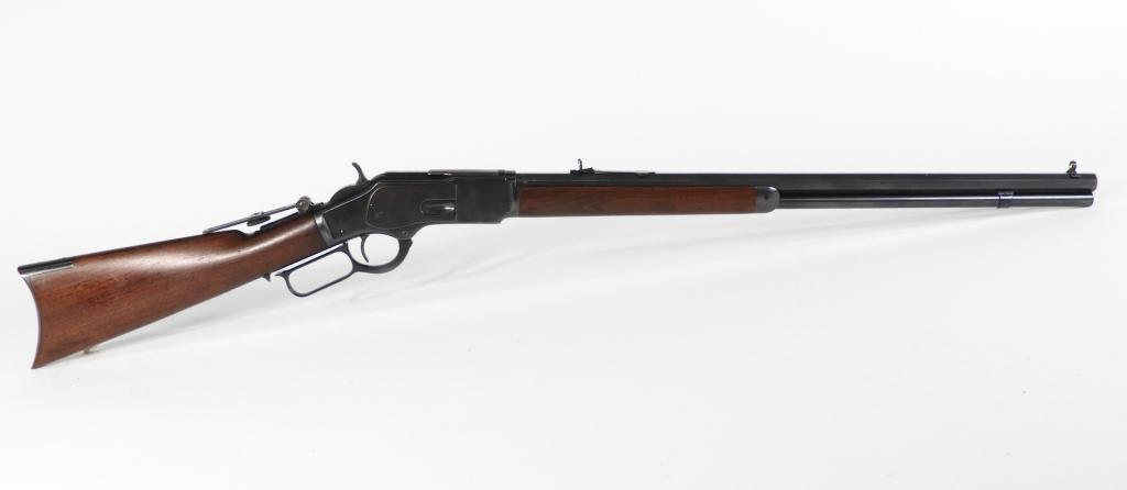 Winchester Model 1873 Rifle: United States C. 1889 .38 W.C.F., serial number 312084B, walnut stock, blued finish, marked on the top of the octagonal barrel "WINCHESTER'S REPEATING ARMS. NEW HAVEN CONN. U.S.A./-KINGS IMPROVEMENT P