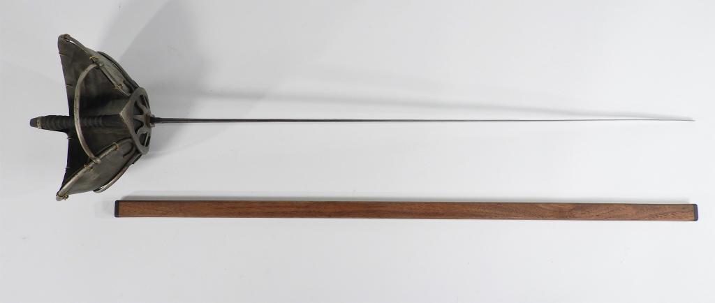 German Schlager Fencing/Deuling Sword: Germany C. late 19th/early 20th century Steel hilt with wide branches, lined with tin, black shagreen grip, marked on the underside of the counter-guard, blued steel blade with gilt foliate designs an