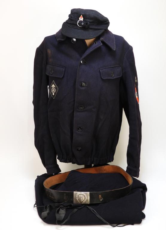 WWII German Hitler Youth Uniform: Germany C. 1926-45 Black jacket with button front, unit insignia on the left sleeve above an HJ patch, a pair of black trousers, belt with HJ buckle, and a black M43-style HJ cap with sewn HJ insignia