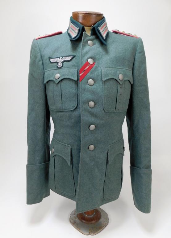 WWII German Model 36 Panzer Captain's Tunic: Germany C. 1936-45 Field gray broadcloth tunic, dark green collar with litzen, captain's epaulets with pink panzer piping, embroidered breast eagle, eastern front ribbon, gray/green rayon lining with 