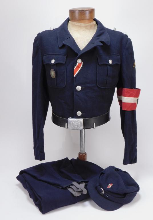 WWII German Hitler Youth Winter Uniform: Germany C. 1926-45 Black tunic with belt hooks at the waist, sleeve patch marked "Sudoft/Steiermark" with an HJ armband, iron cross ribbon, "Steiermark" pin on the right pocket, M43-style cap with ins