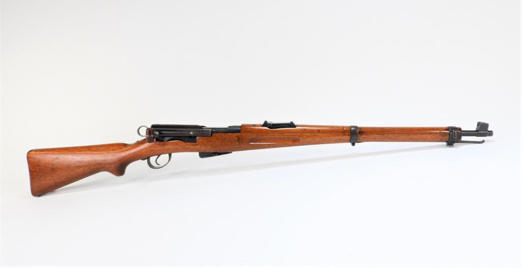 Swiss Model 31 Rifle: Switzerland C. early to mid-20th century 7.65 Swiss, serial number 49658, walnut stock, blued steel fittings, with a Swiss cross and proof marks on the receiver ring. Note: FFL/C&R Barrel lg. 23".Over