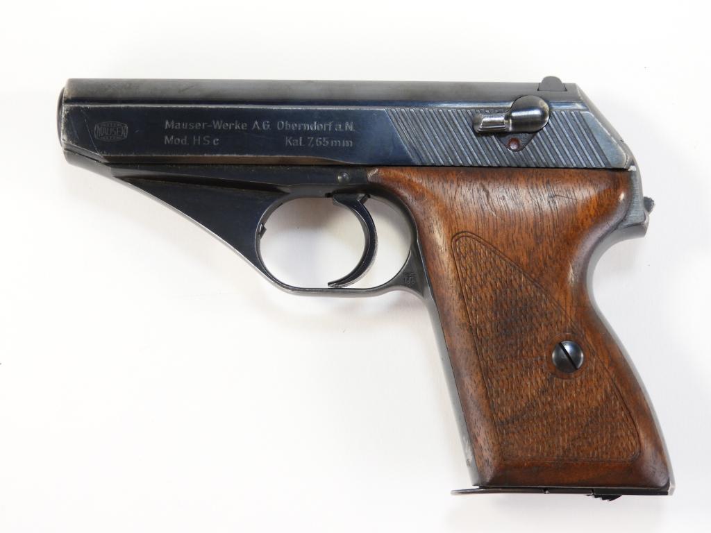 German Mauser HSc Pistol: Germany C. 1940-45 7.65mm, serial number 757045, walnut grips, left of the slide marked with the Mauser logo and "Mauser-Werke A.G. Oberndorf a.N./Mod. HSc Kal. 7.65 mm," waffenamt markings on either 