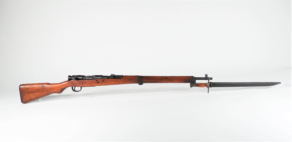 Japanese Type 99 Short Rifle and Bayonet: Japan C. 1939-45 7.7Ã—58mm Arisaka, serial number 2074, walnut stock, blued steel fittings, intact chrysanthemum on the receiver ring, missing the monopod and magazine follower/spring, with a bayon