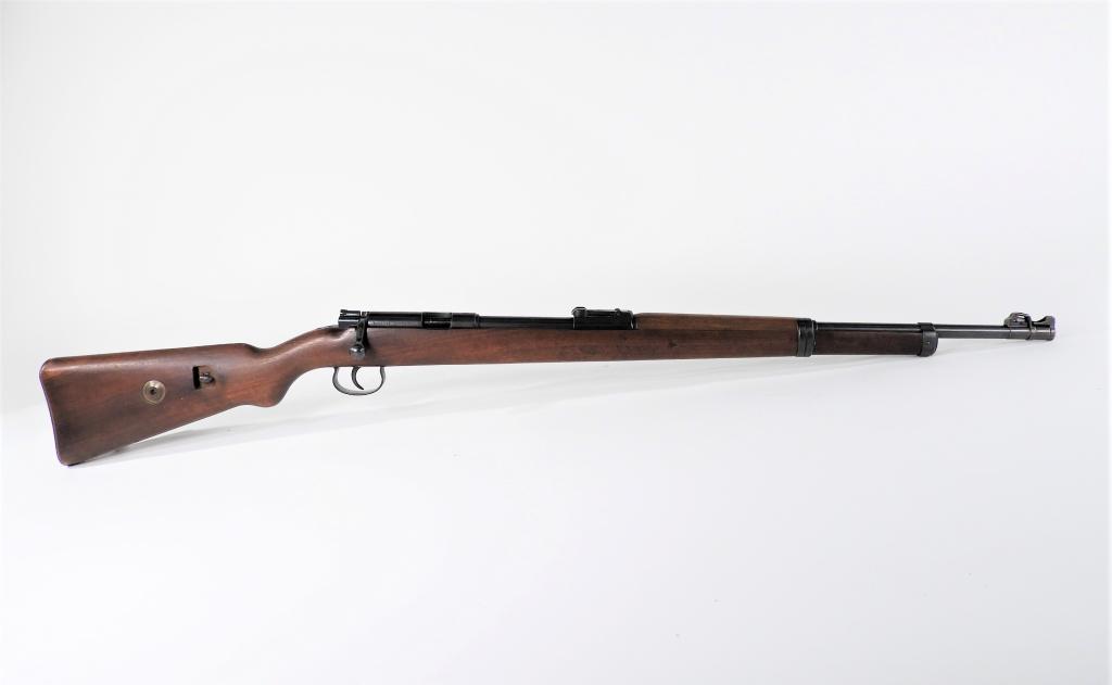German Mauser DSM 34 Bolt Action Rifle: Germany C. 1930s .22 caliber, serial number 19635 all matching, walnut stock, steel fittings, blued finish, marked on the top of the receiver ring "MAUSER," and on the left side of the receiver "MAUSE