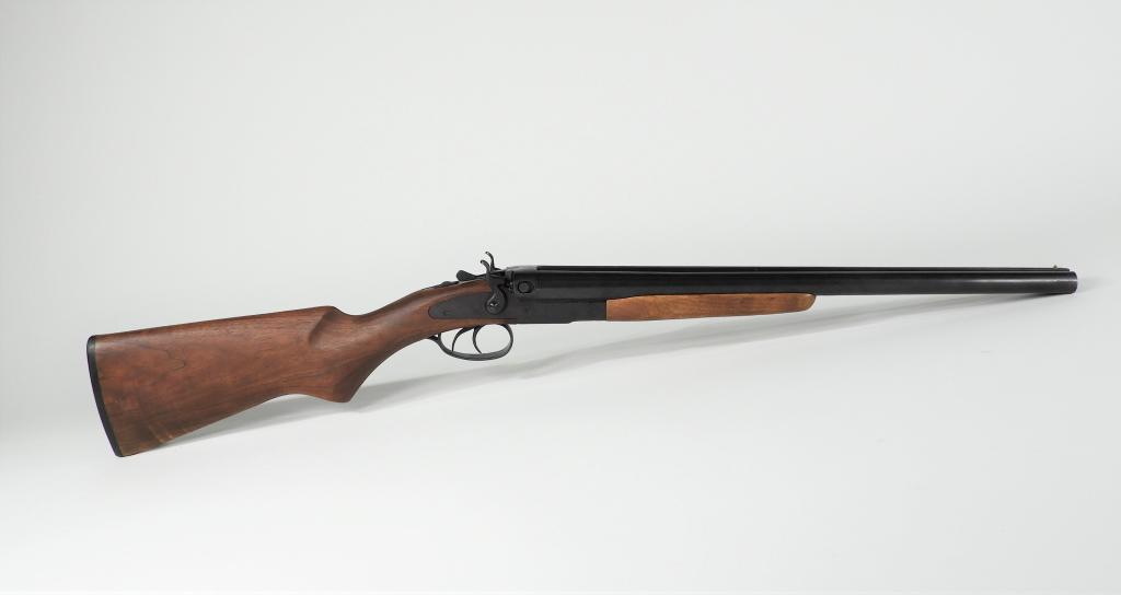IAC Model 99 1887 Coach Shotgun: China C. late 20th century .12 gauge, serial number 16, walnut stock, blued finish, marked under the receiver "MADE IN CHINA/IAC BILLERICA MA," marked on the top of the left barrel "MODEL 99/1887 COAC