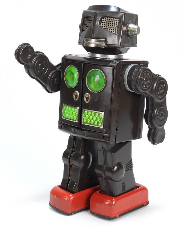 Japanese Horikawa Attacking Martian Tin Robot: Japan,Circa 1950 Horikawa battery operated tin lithograph "Attacking Martian" robot, approximately C8 with light areas of scratching and rubbing to paint, battery compartment is clean with minimal sig