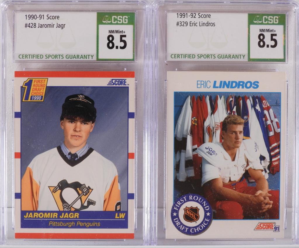 Score Hockey Jaromir Jagr Eric Lindros Rookie CSG: United States,1990-1992 Group includes 1991 Score Hockey Jaromir Jagr #428 and 1992 Eric Lindros #329 trading cards, both CSG 8.5 NM/Mint+. CSG case 5 1/4" x 3 1/8"