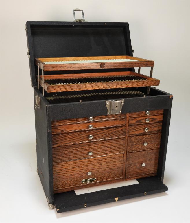 H. Gerstner & Sons Oak Interior Machinist Tool Box: Ohio, 20th Century Model 10 E tool box with leather finish featuring three folding shelves over eight drawers with oak fronts and modern stainless steel pulls. 14 3/4" t x 16 1/8" w x 9 1/8" d. From t