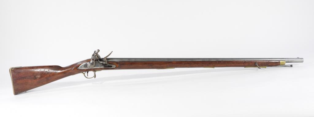 British East India Company "India" Pattern Musket: England,C. 1810 .77 bore, walnut stock, brass fittings, lock marked on the tail "1810," lock marked in front of the cock with a rampant lion, breech marked with proof marks, and a steel ramrod (replac