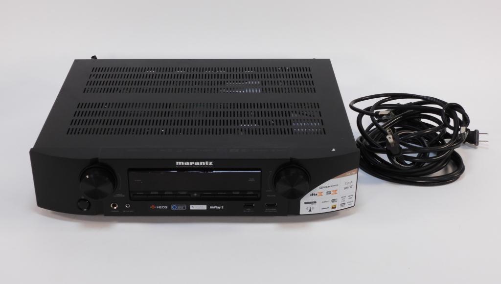 Marantz Model NR 1710 Slim AV Surround Receiver: Japan, Vietnam,Modern Supports wifi, ethernet, and blue tooth connectivity and comes with a Marantz cover and AM antenna packet. Plastic, metal,4" t x 17 1/4" w x 13 1/2" d. Marked "Marantz NR 1710" o