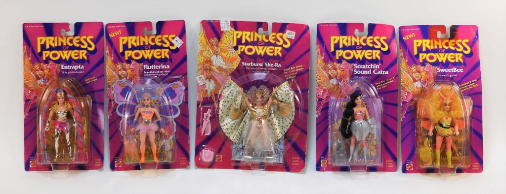5PC Mattel She-Ra Princess of Power MOSC Group: United States,1984-1985 Group includes 1984 Entrapta, Scratchin' Sound Catra, SweetBee, and 1985 Flutterina and Starburst She-Ra, all factory sealed with light to moderate shelf wear including curling