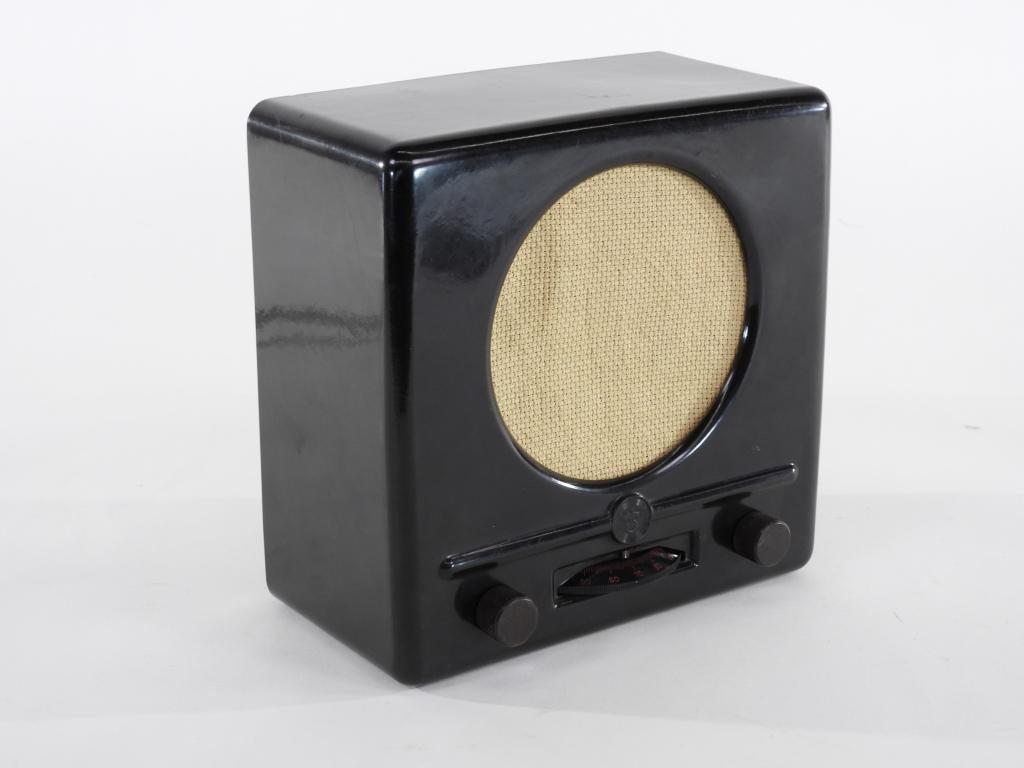 WWII German Bakelite Propaganda Radio: Germany,C. 1930s-40s Black bakelite case with central eagle and swastika above the dial.Ht. 9 1/2". Wd. 4 3/4"
