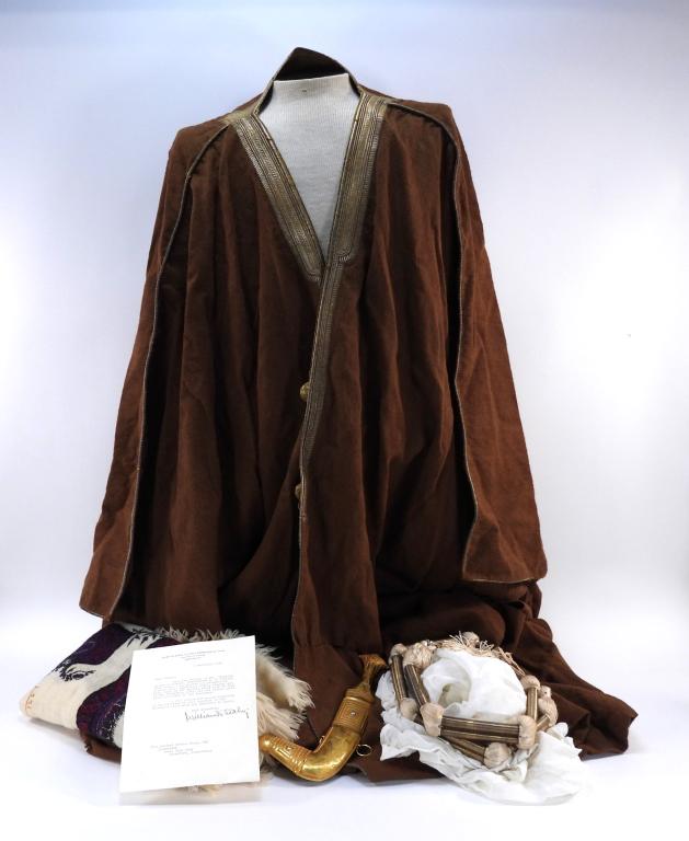 President Franklin D. Roosevelt Presentation Items: Saudi Arabia,C. 1945 A brown robe, head scarf, agal head band, shawl, and dagger with gold and stones, with a note that states "CHIEF OF STAFF TO THE COMMANDER IN CHIEF/THE WHITE HOUSE/WASHINGTON/6 Se