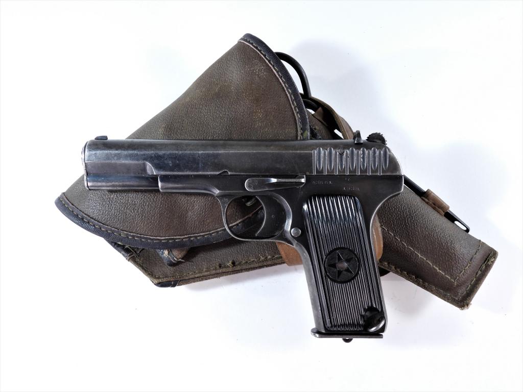 Russian Tokarev TT-30 1st Variation Pistol: Russia,C. 1934 7.62 x 25mm Tokarev caliber, serial number 43661, black bakelite grips with a star and "CCP" (partially defaced), blued finish, marked on the left side of the frame "43661/1934", marked