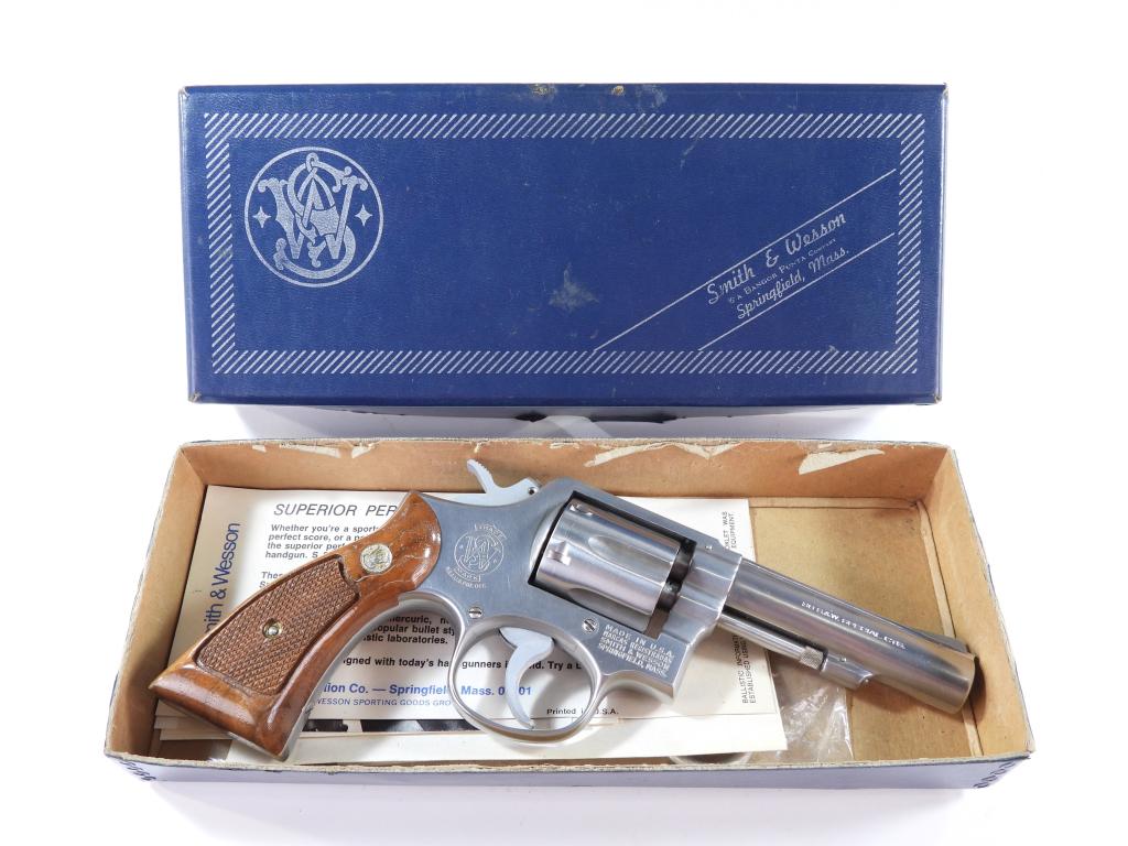 Smith & Wesson Model 64-1 Revolver: United States,C. 1976 .38 caliber, serial number 106301, checkered walnut grips with Colt medallions, stainless finish, marked on the left side of the barrel "SMITH & WESSON", and on the right "38 S.&