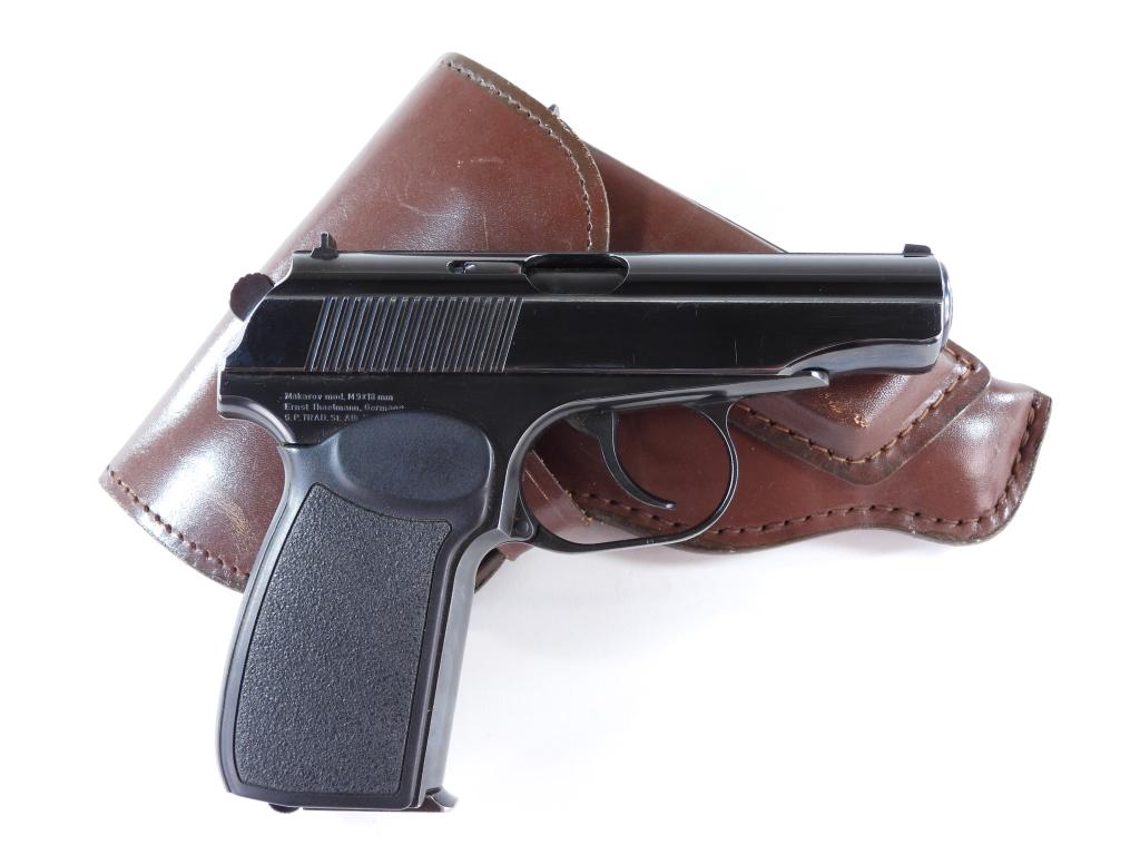 East German Makarov Pistol and Holster: Germany,C. 1961 9mm Makarov caliber, serial number AY 7990, plastic grips, blued finish, marked on the right rear of the frame with import markings, with a brown leather holster and spare magazine. No