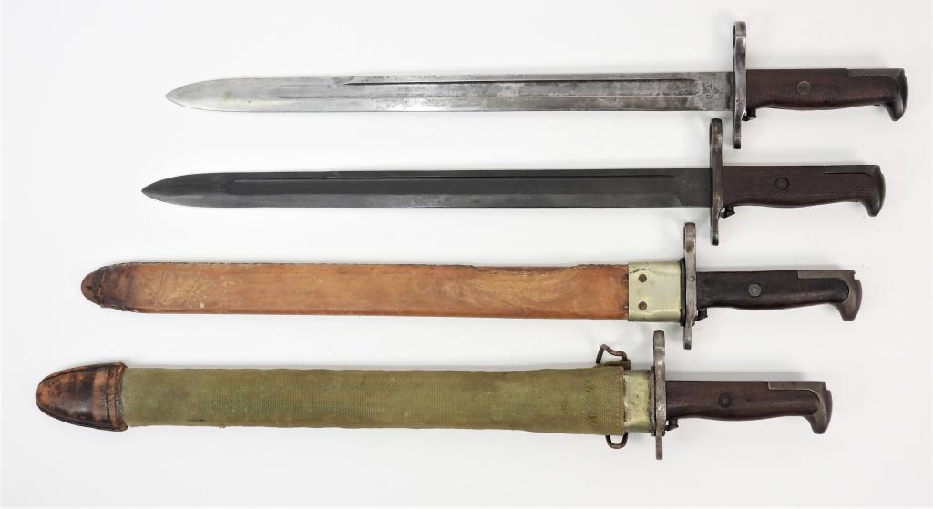 Four U.S. Model 1905 Bayonets: United States, A bayonet in a canvas and leather scabbard marked on the ricasso "SA/1917"; a bayonet with partial scabbard marked on the ricasso "RIA/1917"; a bayonet with no scabbard marked "SA/1906"