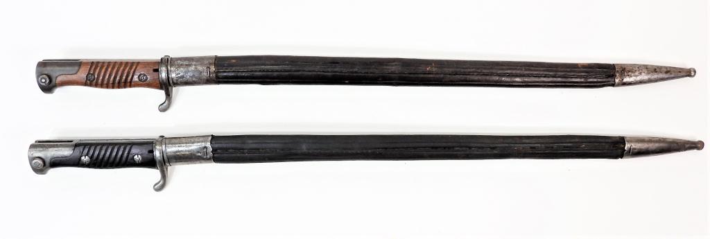 Two German Model 1898 n/A 2nd Type Sword-Bayonets: Germany, A bayonet dated 1903 and marked "C.G. HAENEL/SUHL" with "B.12.R.7.199" unit marking on the guard and scabbard throat; and a bayonet dated 1907 and marked "C.G. HAENEL/SUHL", and a leather sca