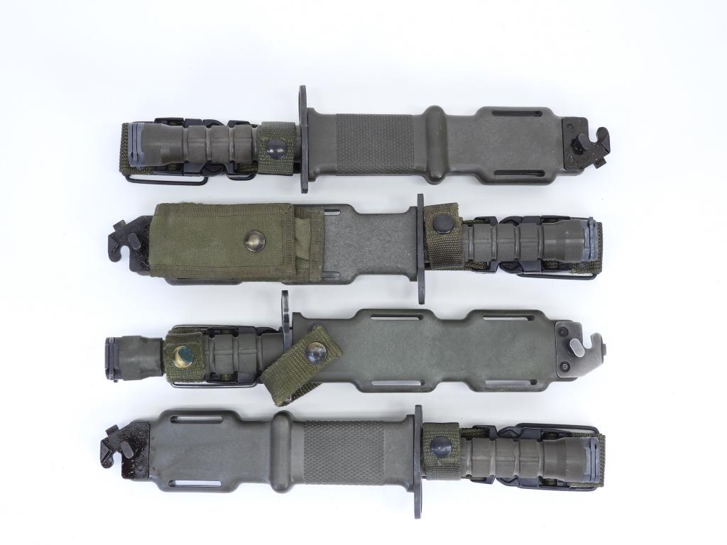 Four U.S. M9 Military Bayonets and Scabbards: United States, Two M9's with a blued blade, marked "US" on one side, and M9 UTILITY" on the other; an M9 with a bright blade marked "M9/PHROBIS III/U.S.A./PAT. PEND."; and an M9 marked "M9/LANCAY/USA"