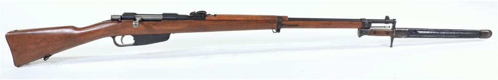 Italian Model 1941 Carcano Rifle and Bayonet: Italy,C. 1943 6.5 caliber, serial number 4195, walnut stock with crest on the left side of the butt below the sling swivel and "G/7774", blued finish, marked on the receiver ring with a crown over "FA