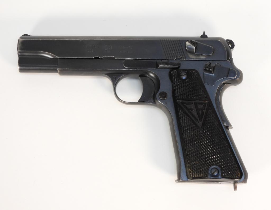 Polish Pre-War VIS-35 Radom Pistol: Poland,C. 1938 9mm, serial number 11039, black checkered Bakelite grips marked "FB", blued finish, marked on the left side of the slide with a Polish eagle and "F. B. RADOM/1938r/ VIS-WZ 35/pat. Nr. 1