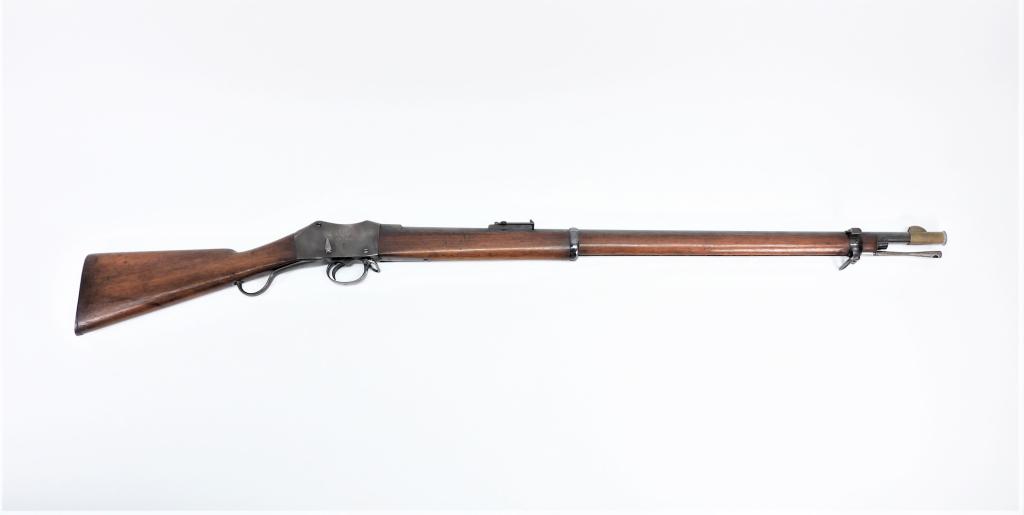 British Martini-Henry Mark III Rifle: England,C. 1882 .577-.450 caliber, NSN, walnut stock with cartouche on the right side of the butt, blued finish, marked on the right side of the receiver with a crown over "V.R./B.S.A.& M. Co./1882/II