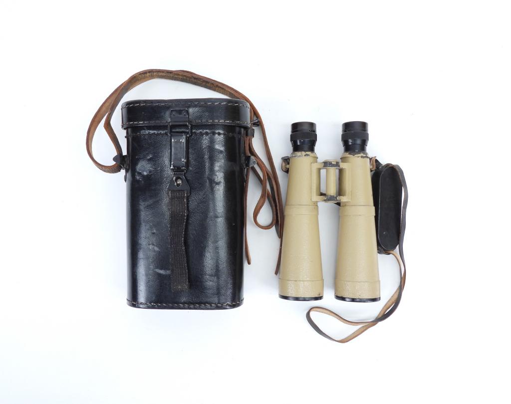 WWII German Zeiss 10x50 Binoculars and Case: Germany,C. 1943 Ordnance tan-painted body, marked "Dienstglas 10 x 50" and "bmj 587775", with Bakelite eye cups, and rubber eye cup cover, leather strap, and a leather case marked inside the lid "bmj
