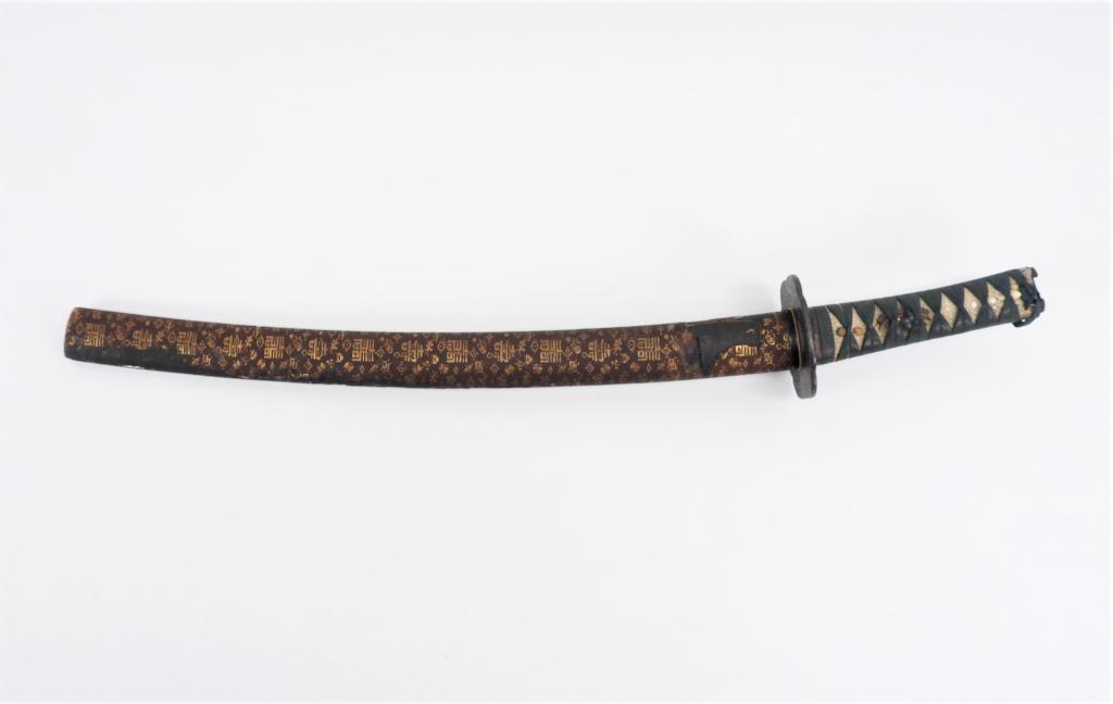 Japanese Wakizashi and Scabbard: Japan, Green tape-wrapped shagreen grip with one mekugi on each side, iron tsuba, steel blade, and a cloth-covered wooden scabbard. Blade lg. 18 1/8".Overall lg. 24 3/8"