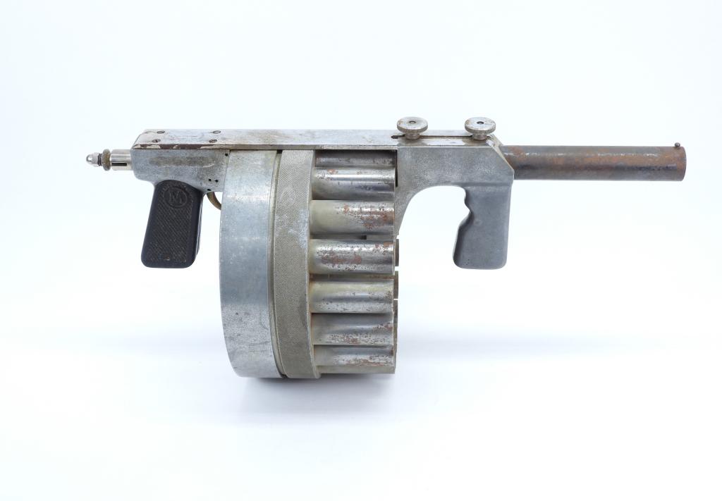 Manville Manufacturing Eighteen-shot Flare Gun: United States,C. 1938-43 26.5mm, serial number 758, aluminum body, rubber grip marked with an "M" in a circle, round drum to hold 18 cartridges, marked on the top strap "MANVILLE MFG. CO./PAT. APPLIED