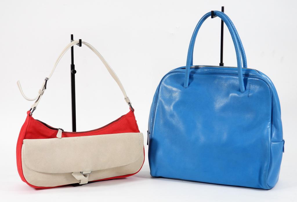 2PC Jil Sander Leather & Suede Bags: Includes a double handled vibrant blue leather bag with zipper closure and silver metal hardware, and a tan suede bag with red canvas sides zipper closure, and silver metal hardware. Guaranteed authen