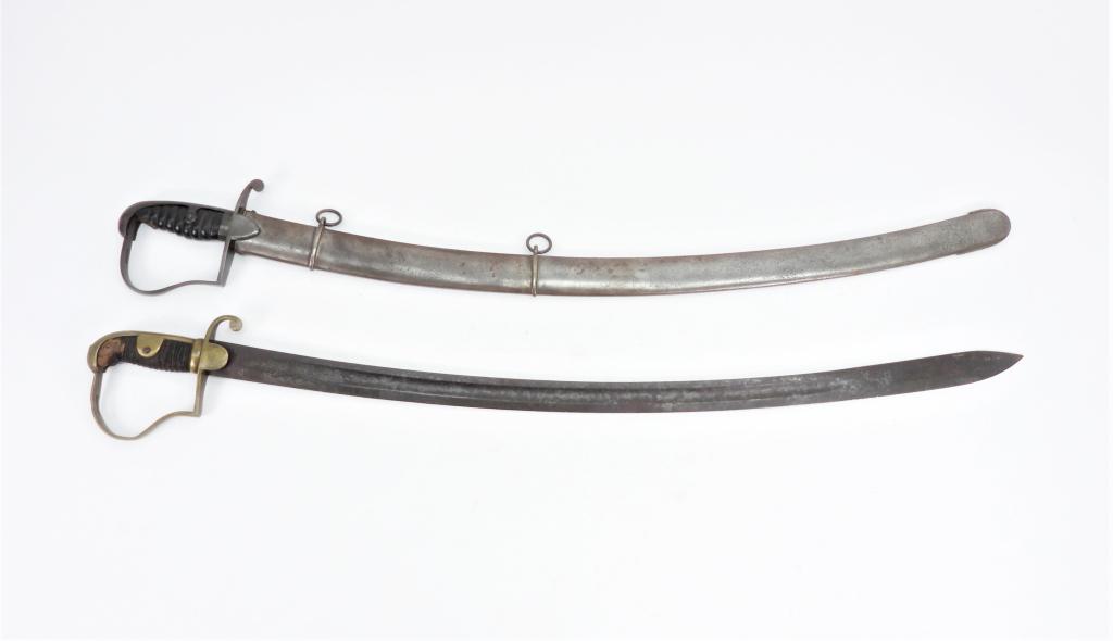 Two Cavalry Sabers: A British Pattern 1796 cavalry saber and scabbard; and a brass hilted cavalry saber with no scabbard.