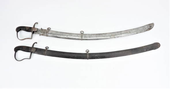 Two German Cavalry Sabers: A saber with "GL" engraved on the langet, wooden grip, and a steel scabbard; and a saber with some grip damage, and a steel scabbard.