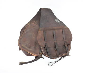 U.S. Model 1904 Saddle Bags: United States C. 1917 Brown leather saddle bags with stippled finish, with a "U.S" embossed on each flap, marked "LONG/1917/W.J.D." on the connecting strap. E.Mc.C. engraved on the top and underside
