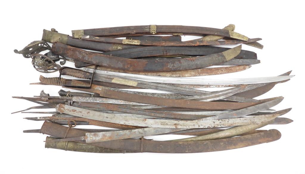 Large Group of Sword Blades and Scabbard Parts: Group of sword blades, scabbards, and scabbard parts, two hilts, and a Starr NCO sword.