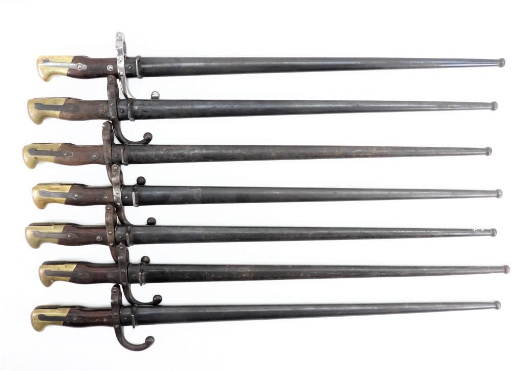 Seven Model 1874 French Gras Bayonets: France Seven Gras bayonets and scabbards, two with matching numbered scabbards. Blade lg. 20 1/2".Overall lg. 25 3/8" Blade lg. 20 1/2".Overall lg. 25 3/8"